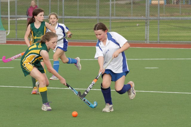 Norths' Katelin Jobbins narrowly evades the tackle of Wombats' Evie Nelson